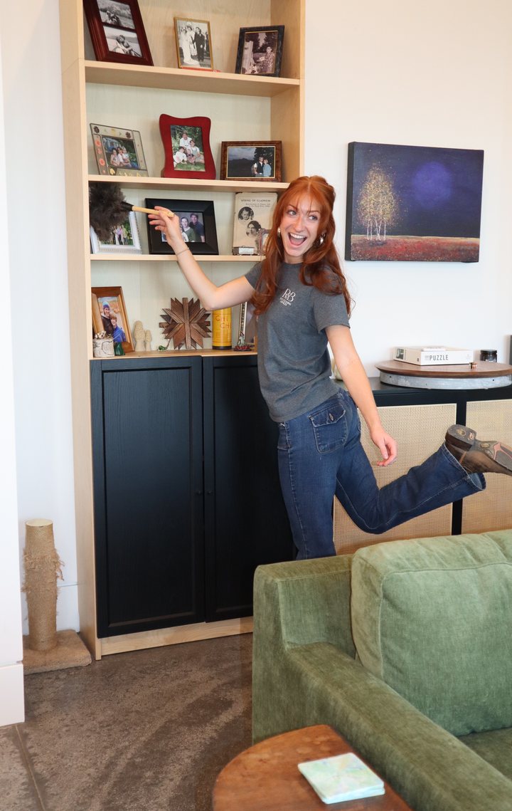 R&B Elite Cleaning team member dusting shelves during a residential house cleaning in Sagle, Idaho
